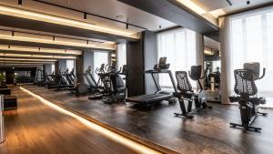 a gym with a row of treadmills and machines at Shinagawa Prince Hotel N Tower in Tokyo