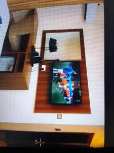 a living room with a tv in a wall at Villa toscana okpanam Rd Asaba in Okpanam