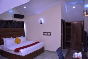 Cama o camas de una habitación en Konklave Inn and Apartment