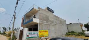 a building on the side of a street at OYO Flagship Hotel Pranav Inn in Faizābād