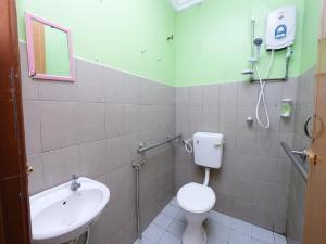 a bathroom with a toilet and a sink at MRJ Hotel Wakaf Che Yeh 2 in Kota Bharu +19 photos