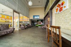 a store with chairs and tables and a waiting room at MRJ Hotel Wakaf Che Yeh 2 in Kota Bharu
