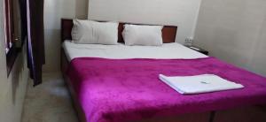 Ένα ή περισσότερα κρεβάτια σε δωμάτιο στο OYO Flagship 19355 Hotel Blessing Inn