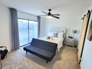 a bedroom with a bed and a ceiling fan at Vegas best stay in Las Vegas