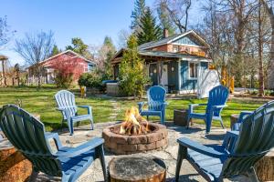 a group of chairs around a fire pit in a yard at Modern & Cozy on Private Lane, Minutes to Airport in Fletcher