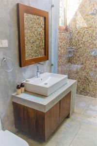 a bathroom with a sink and a shower at Cobalt Villa by The Serendipity Collection in Kandy