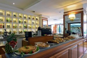 a bakery with a buffet of food on a counter at Grand Hotel Tiberio in Rome