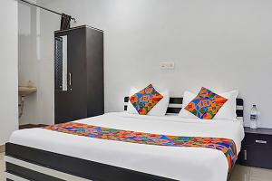 Krevet ili kreveti u jedinici u objektu FabHotel Galaxy Airport Inn