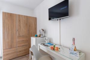 TV a/nebo společenská místnost v ubytování Residenza La Serenata
