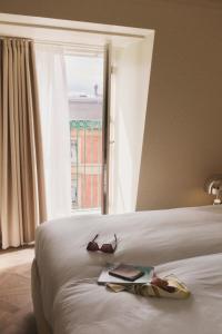 A bed or beds in a room at Hotel Bella Grande