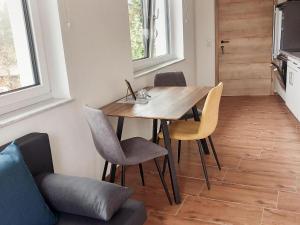 a dining room with a wooden table and chairs at Beautiful and Cosy Flat in Wagrain in Wagrain