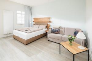 Postel nebo postele na pokoji v ubytování Nordstrandperle Ap E10