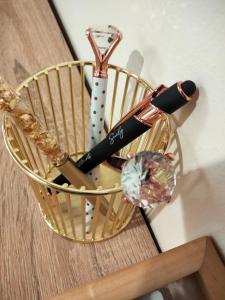 a basket with a bunch of utensils in it at Atena apartments in Agrigento