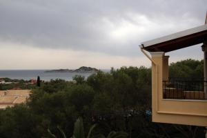 a view of the ocean from a house at Villa Helen in Arillas
