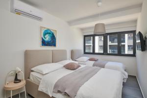 Llit o llits en una habitació de Irena Apartment No 2