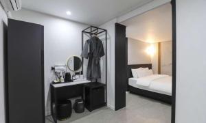 Postel nebo postele na pokoji v ubytování JECHEON No 25 HOTEL