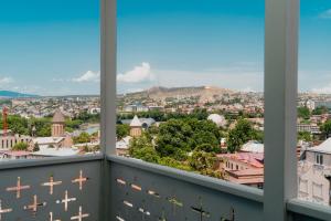 a view of a city from a balcony at Amante Narikala Boutique Hotel in Tbilisi City