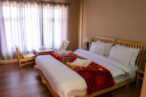 En eller flere senge i et værelse på Gongma Residency