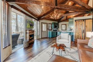 a living room with wood ceilings and a fireplace at Chalet 254 - Cozy luxury in Big Canoe in Marblehill