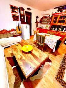 a living room with a table in the middle of it at Casa Nuova Tekija - Kladovo in Tekija +46 photos