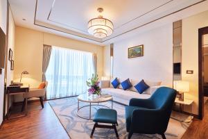a living room with a couch and a table at Taj Bangalore in Devanahalli-Bangalore