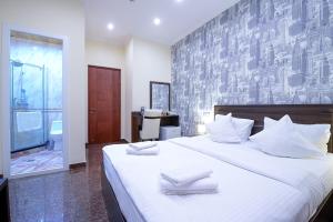 Postel nebo postele na pokoji v ubytování Mia Casa Hotel Yerevan + 110 fotografií