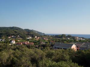a small town on a hill with houses at Villa Helen in Arillas +12 photos