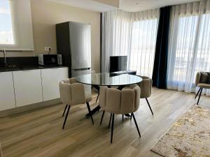 a kitchen and dining room with a table and chairs at MD Pont de Fusta in Valencia +139 photos