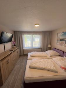 Postel nebo postele na pokoji v ubytování Ferienwohnung - Seebad UeckermündeOT Bellin