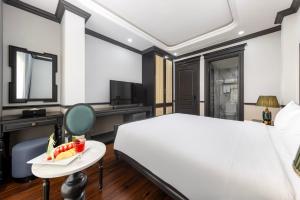 Postel nebo postele na pokoji v ubytování Sapa Soleil Hotel