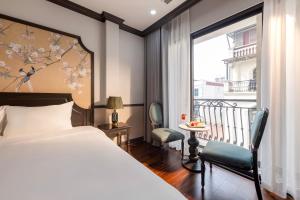 Postel nebo postele na pokoji v ubytování Sapa Soleil Hotel