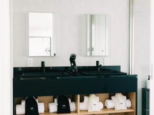 a bathroom with a sink and a shelf of shoes at TEF TANIGUMI - Vacation STAY 78822v 