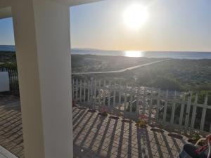 a view of the ocean from the balcony of a building at Holiday Beach House in Velddrif