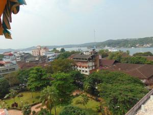a view of a city with trees and buildings at Hotel Manvin's in Panaji