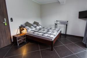 Postel nebo postele na pokoji v ubytování Apartamenty Dawna Wisła