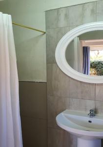 a bathroom with a sink and a mirror at Perdehoek Venue in Lichtenburg +177 photos