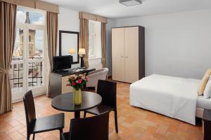 Postel nebo postele na pokoji v ubytování Hotel Praga 1