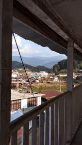 a view of a city from a balcony at Arunachal Guest house in Hāpoli