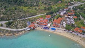 an aerial view of a house on a beach at Angelina Hotel in Ormos Panagias