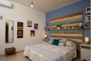 Ένα ή περισσότερα κρεβάτια σε δωμάτιο στο Iknos Suites by Wonderful Italy