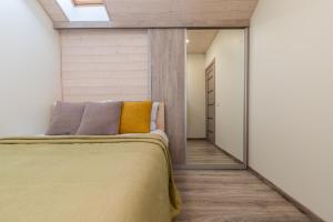 Ένα ή περισσότερα κρεβάτια σε δωμάτιο στο Atostogų namelis prie jūros