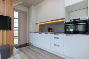 Η κουζίνα ή μικρή κουζίνα στο Atostogų namelis prie jūros