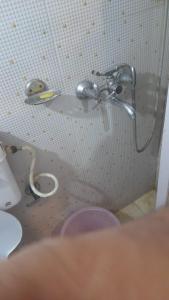 a shower in the corner of a bathroom at Hotel Comfort Hostel Charbagh Inn Lucknow in Lucknow
