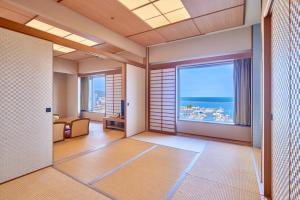 a large room with a view of the ocean at Grand Park Otaru in Otaru
