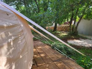 a close up of a tent in a yard at Rock Oak Imotski 1 in Imotski