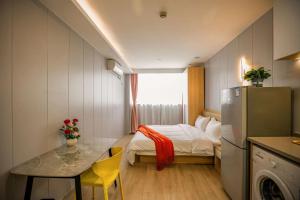 Katil atau katil-katil dalam bilik di KeTangJian Aparthotel
