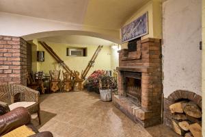 a living room with a brick fireplace in a house at Jaś i Małgosia in Szklarska Poręba +37 photos