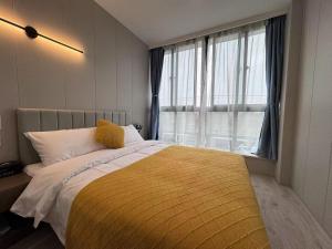 Katil atau katil-katil dalam bilik di KeTangJian Aparthotel