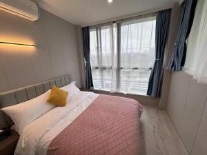 Katil atau katil-katil dalam bilik di KeTangJian Aparthotel
