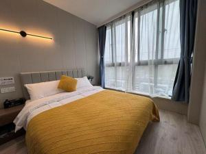 Katil atau katil-katil dalam bilik di KeTangJian Aparthotel